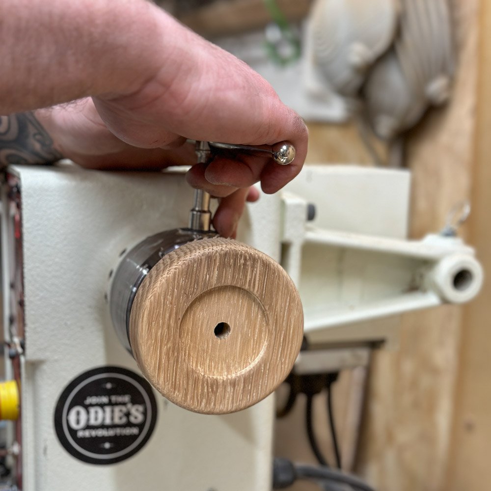 Woodturner making a whisky cask soap dish on a jet lathe