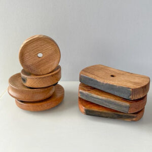 wooden soap dishes made from a whisky casks stacked up on a white background.. The soap dishes are Handmade in Scotland and make great gifts for whisky enthusiasts