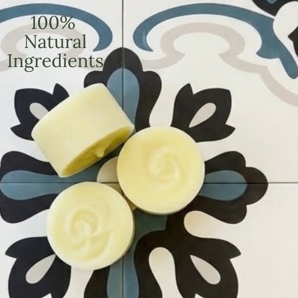 A picture of 3 solid shampoo bars displayed on bathroom tiles. with the works 100% natural ingregents. showing the zero waste bathroom idea, ditch the plastic, plastic free bathroom