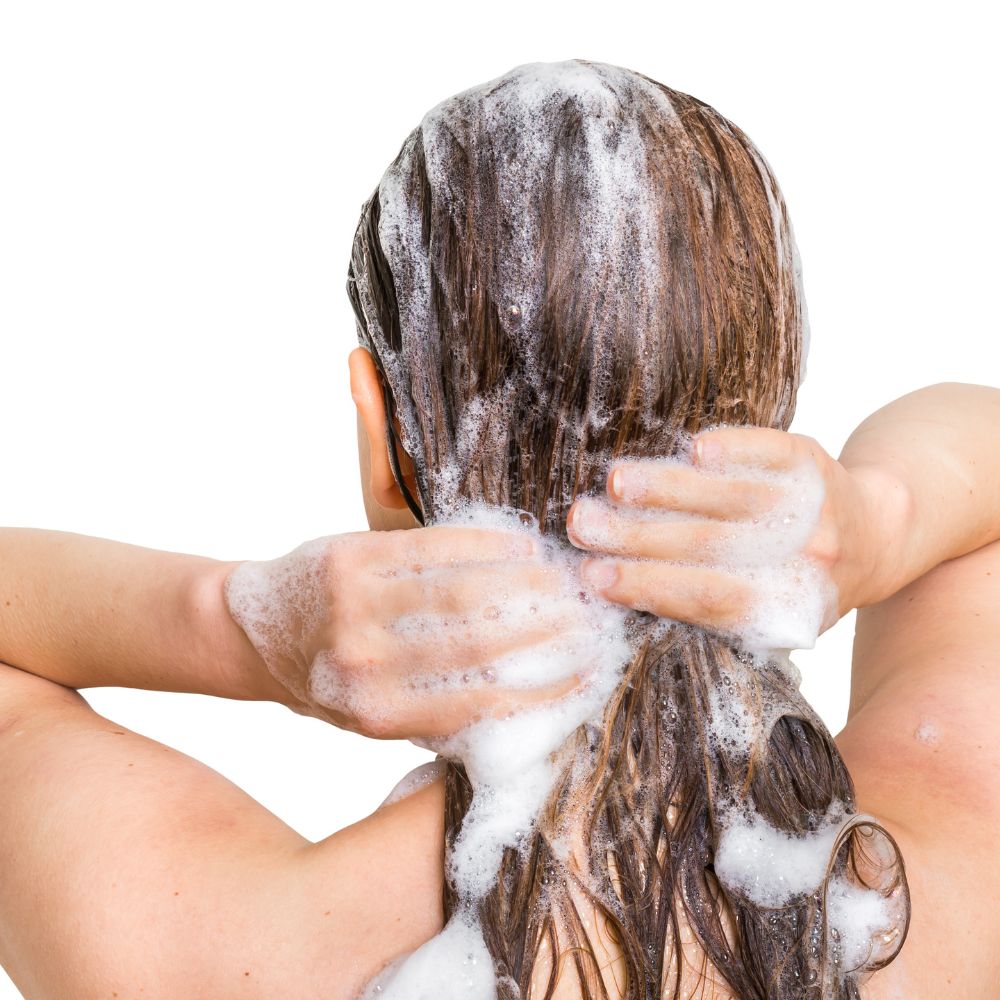 lady washing hair with shampoo bar