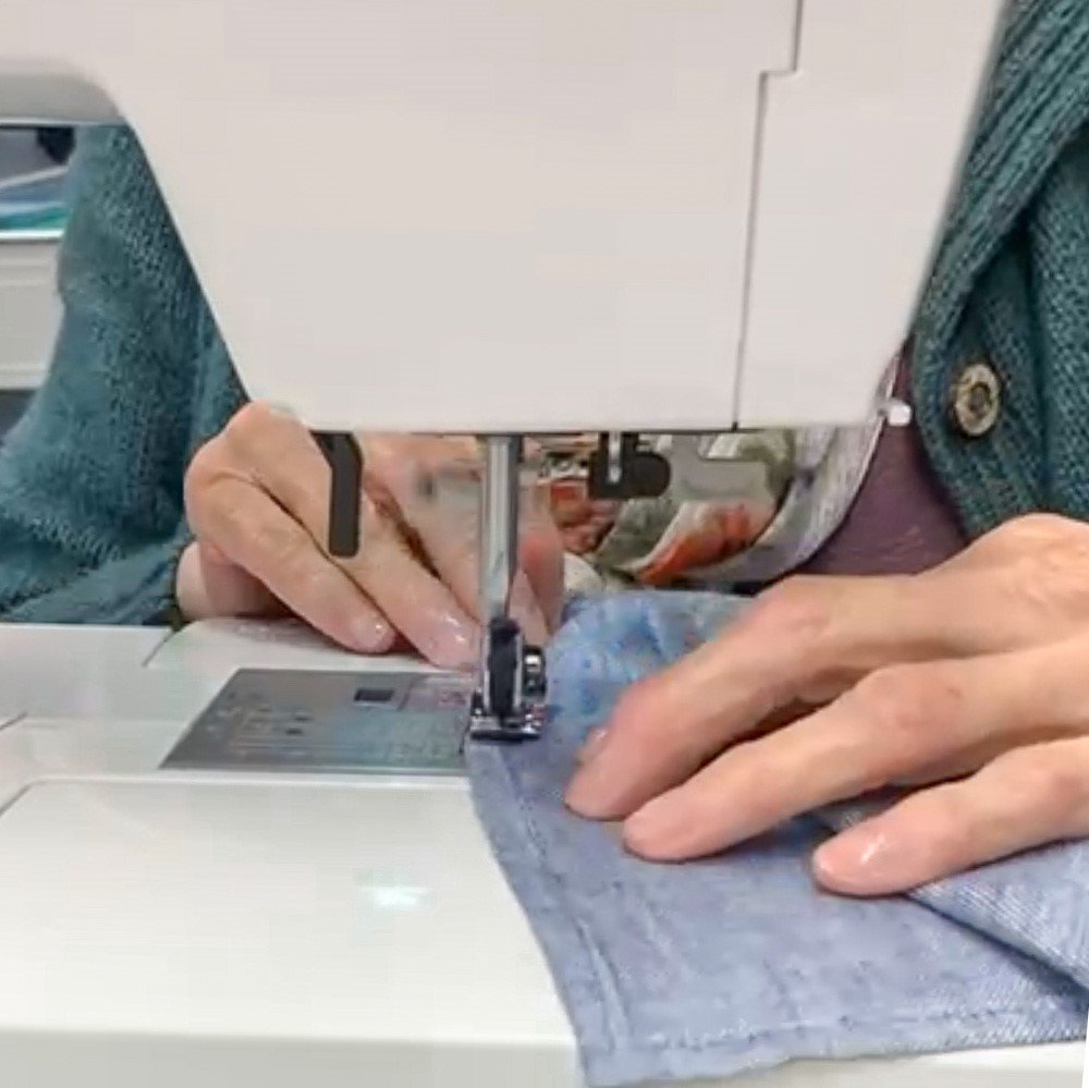 Carol stitching tea towels from Scottish Linen on the sewing machine.