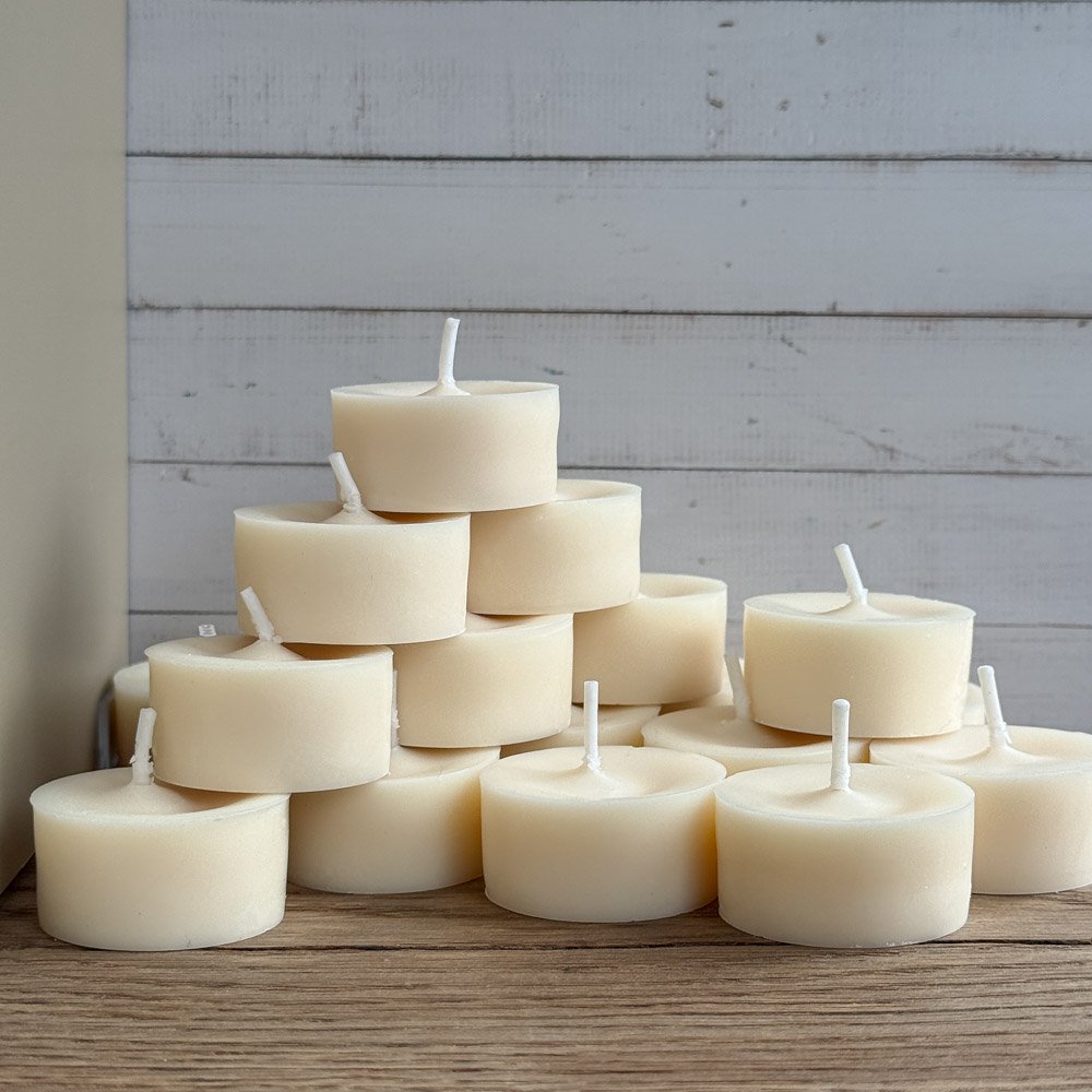 a stack of handamde eco zero waste naked tea lights. tea lights without the metal container