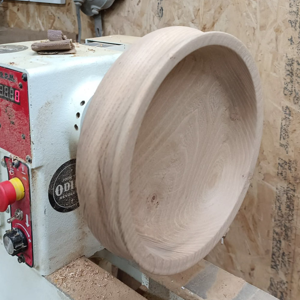 a vintage oak bowl on a jet lathe
