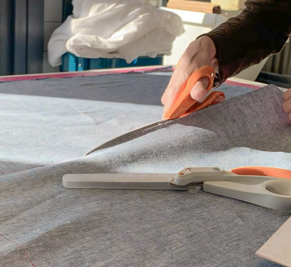 Carol cutting linen with fiskars scissors