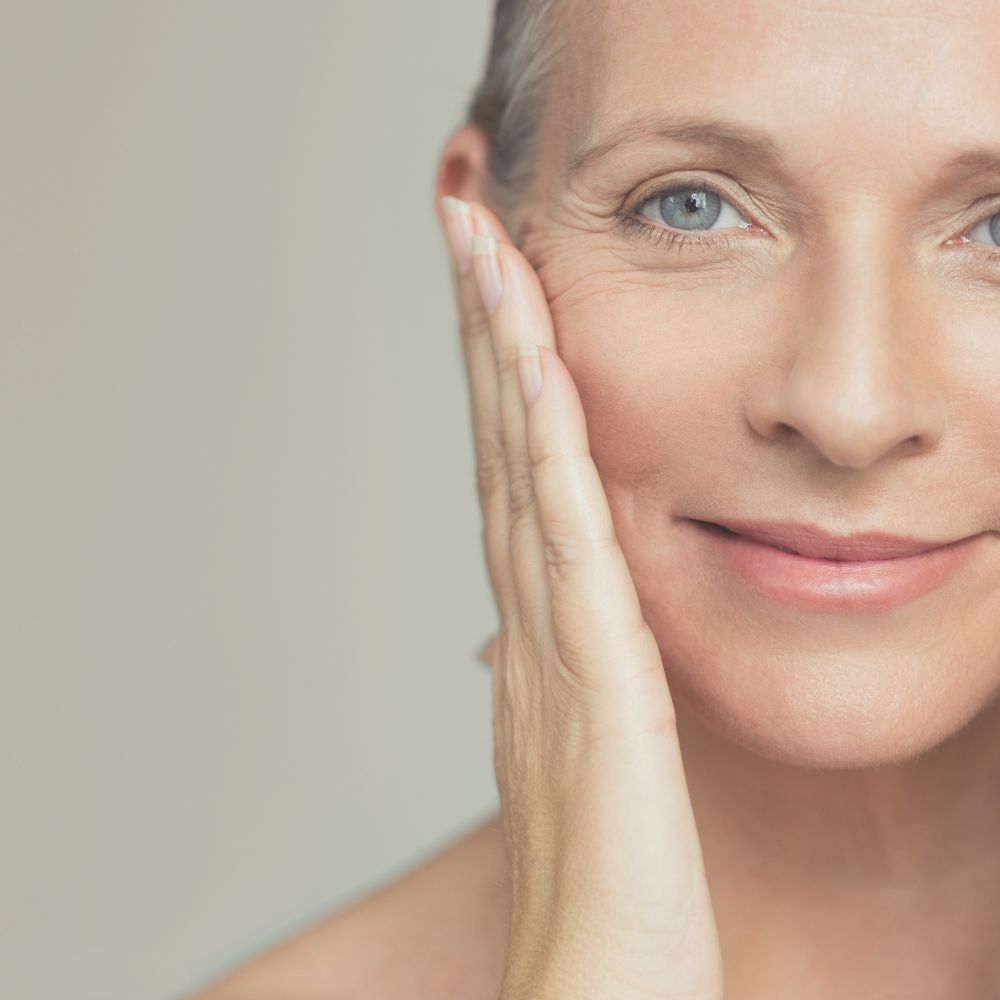 Mature Lady washing face with oil cleanser