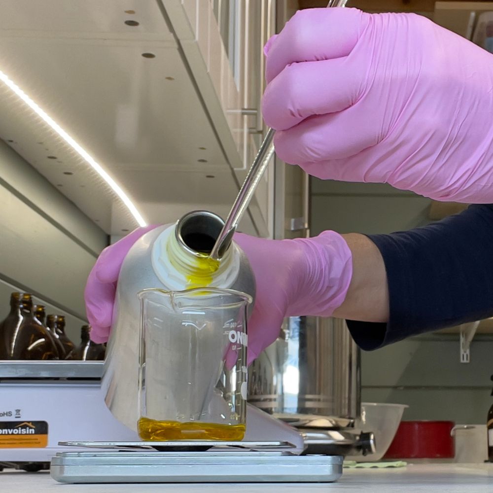 Christine in the lab blending the essential oils for the shampoo bar