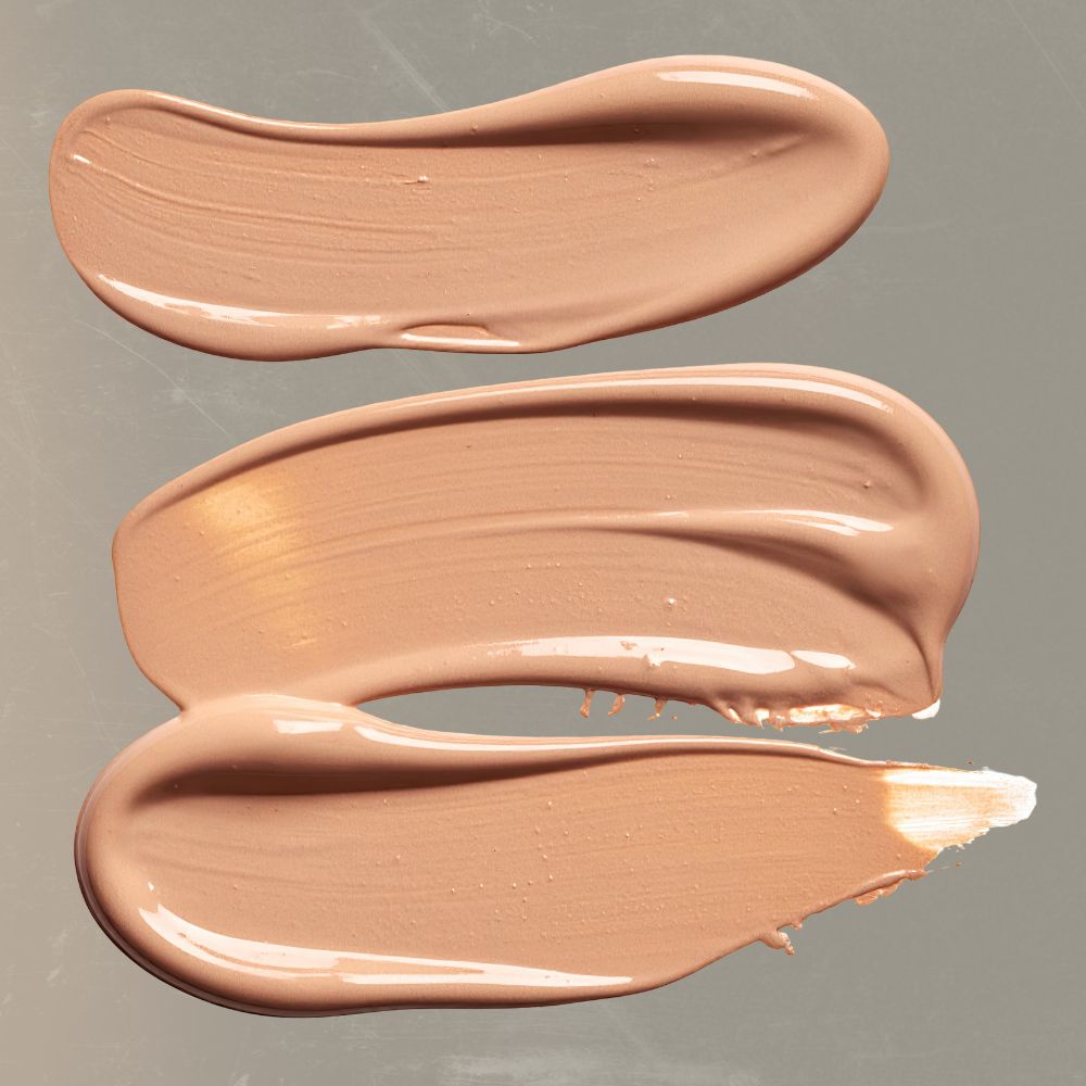 Foundation swipes on a glass background.