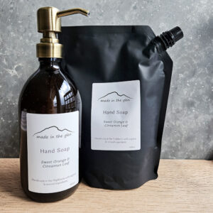 liquid hand soaps by Made in the Glen sweet orange & cinnamon Organic essential oils in an Amber glass bottle with brass metal pump filled with Made in the Glen Liquid hand soap made with organic